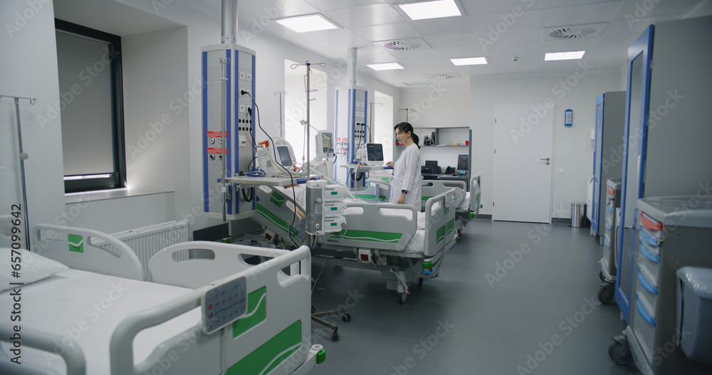 Emergency room with modern equipment in hospital. Elderly man in oxygen ...