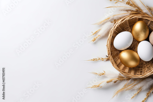 Gold Easter eggs in a nest on a white background, Easter banner 