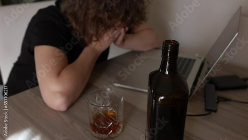alcoholism, alcohol addiction . drunk woman or female alcoholic drinking whiskey at home. Loneliness and stress. Female alcoholism