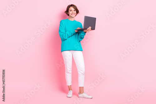Photo of cheerful lovley girl addicted user wear stylish clothes buy quality gadget black friday sale isolated on pink color background photo