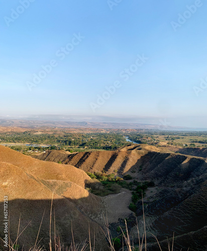 Breathtaking landscape view of highland valleys at Warinding Hill, Sumba, Lesser Sunda Island, Indonesia. A naturally made highland savanna in the tropics. Famous for tourist and getting popular.