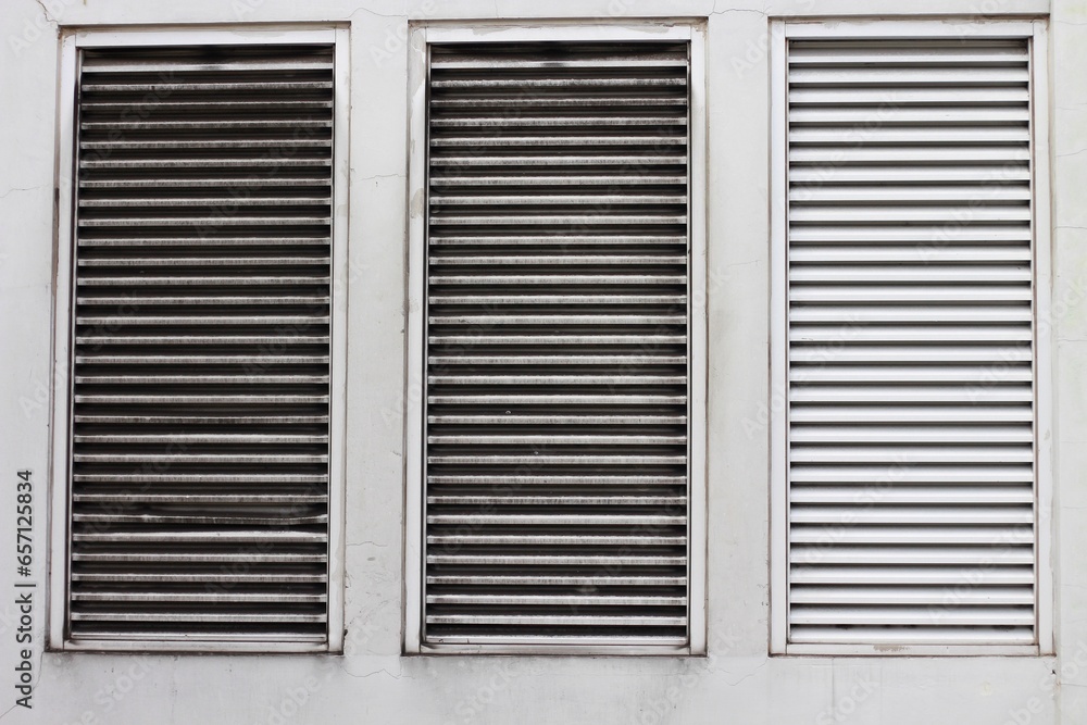 Close up of room air conditioning ventilation on the outside wall of the hospital