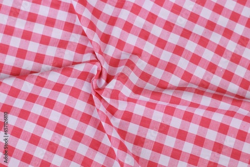 wrinkled classic pink plaid fabric or tablecloth background