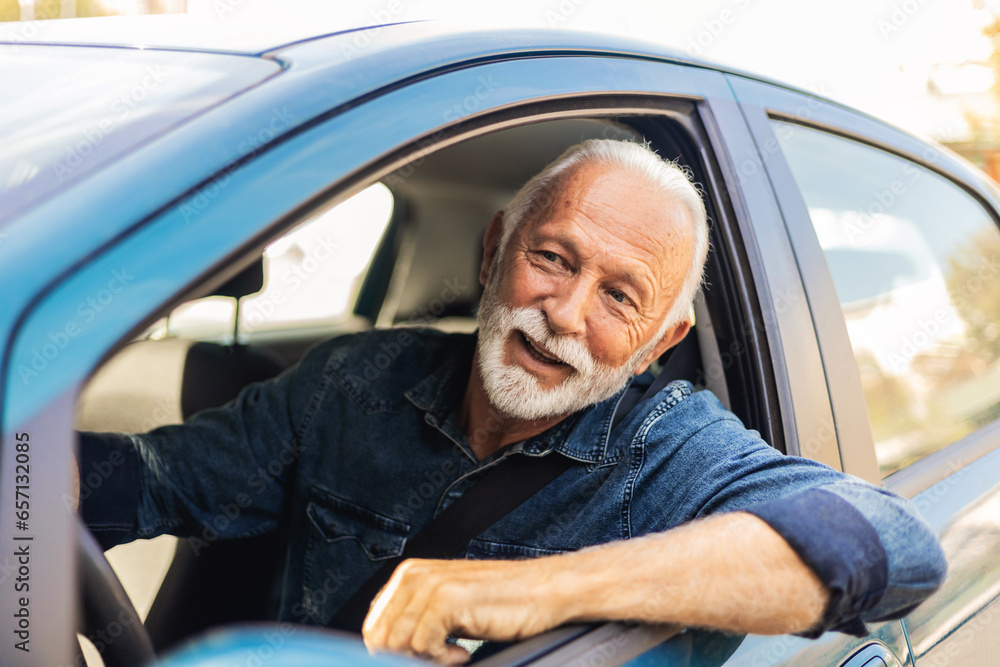 Cropped shot of a senior man driving his car. Cropped shot of a senior man driving his car.