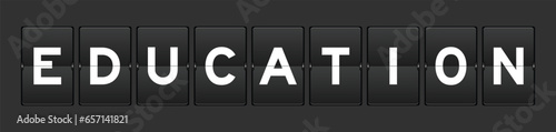 Black color analog flip board with word education on gray background