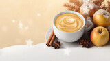 Creamy coffee cappuccino with apples and spices on snow with falling snowflakes in the background.