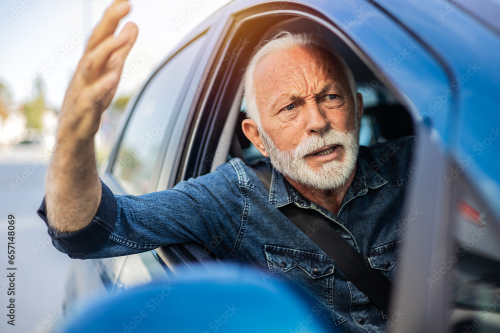 Angry senior man yelling out car window. Frustrated mature man driving a car and shouting at other driver. - obrazy, fototapety, plakaty 