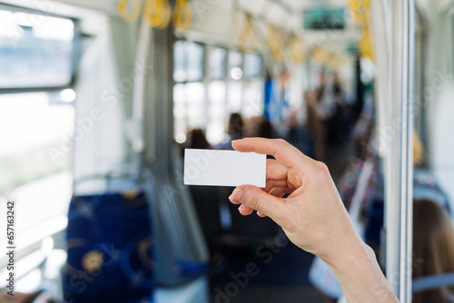Ticket with copy space against blurred indoors public transport background photo
