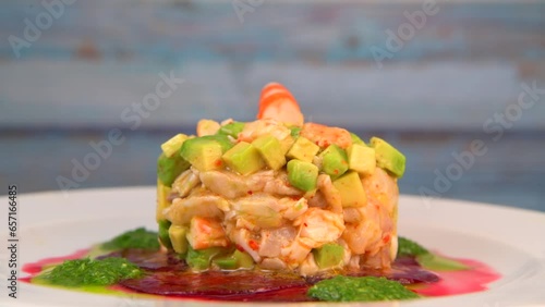 RECIPE FOR CEVICHE OF BREATHER, SHRIMP, AVOCADO, LIME, PARSLEY SAUCE, OLIVE OIL AND LEMON ON A BED OF BEET, High quality 4k footage photo