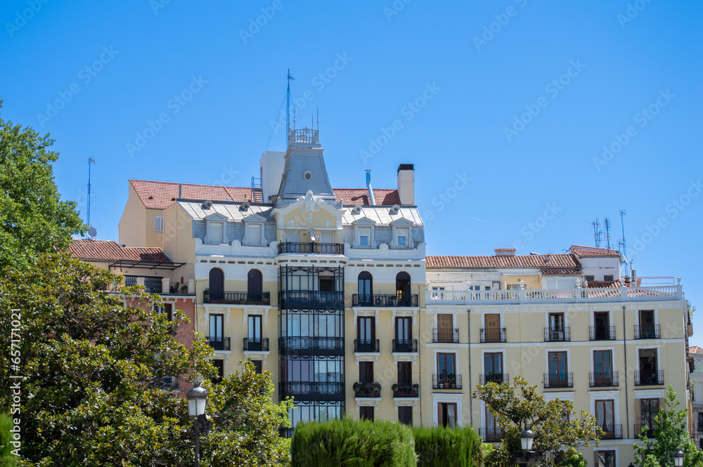 Surrounding buildings near Royal Palace of Madrid on summer sunny day in Madrid, Spain