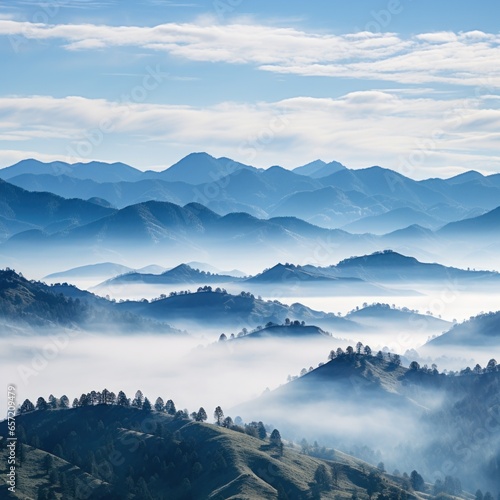 Hazy mountains seen through wispy clouds