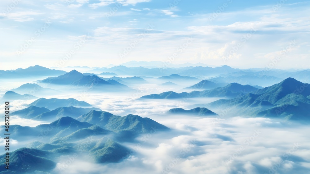 Hazy mountains seen through wispy clouds