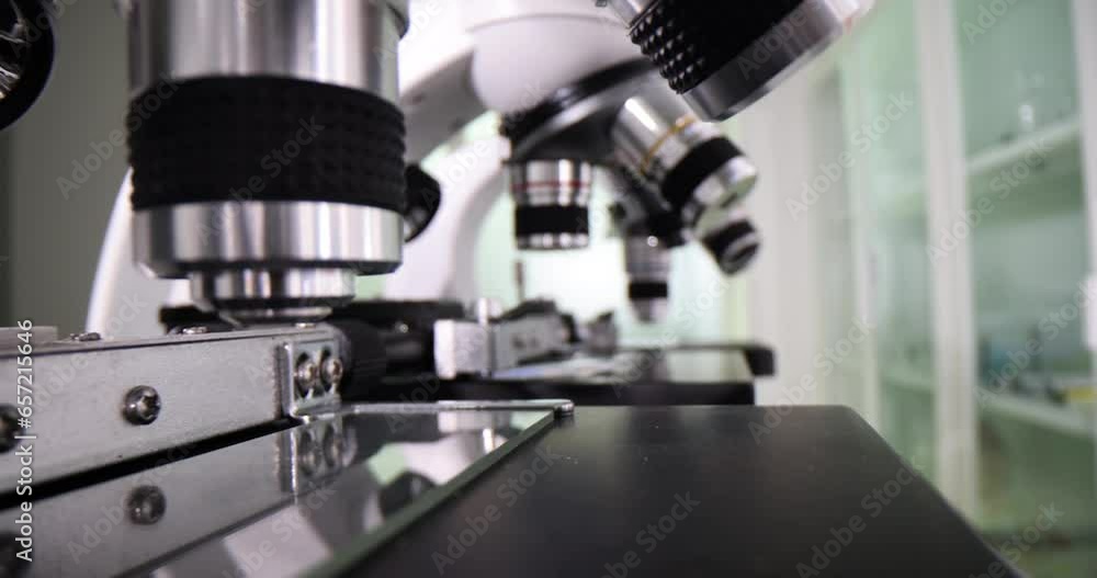 Microscopes for specialized laboratory tests in clinics. Microscopes with various eyepieces for specialized laboratory tests in lab office Microscopes for specialized laboratory tests in clinics. Microscopes with various eyepieces for specialized laboratory tests in lab office