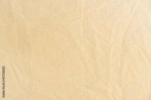 close up crumpled beige textile texture background for template design concept