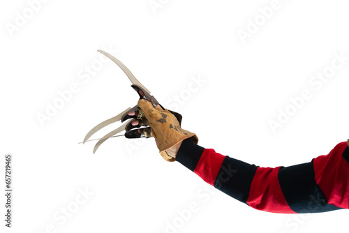 scary hand of  man is like a serial killer freddy with a glove c sharp knives in the mist, background for Halloween photo
