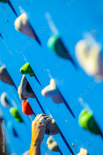 Details of a climber showed in detail as they take part in a competition in an artificial wall in Valaldolid, Spain