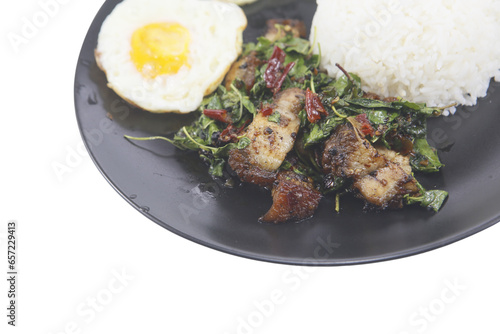 Stir fried Thai basil with pork and a fried egg isolated on white background. Pad Kra Pao