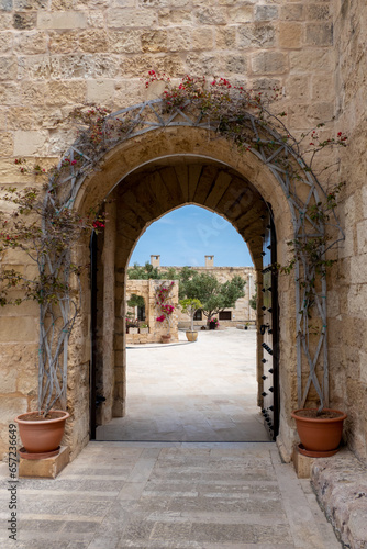Birgu, Malta, May 1, 2023. Gate leading to a courtyard with buildings inside at Fort St Angelo.