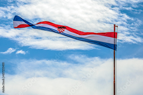 Croatia National Flag waving in the wind on pole photo