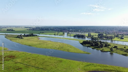 Aerial shot of the river spilling into the surrounding landscape, creating a unique habitat for rare species. The IJssel River near Zwolle photo
