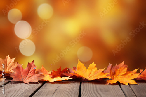 Autumn maple leaves on wooden table. Falling leaves natural background Generative AI