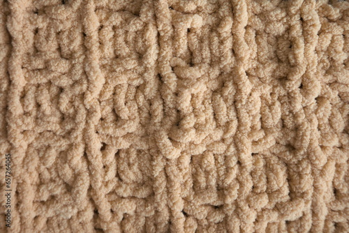 Yellow handmade knitting blanket background.