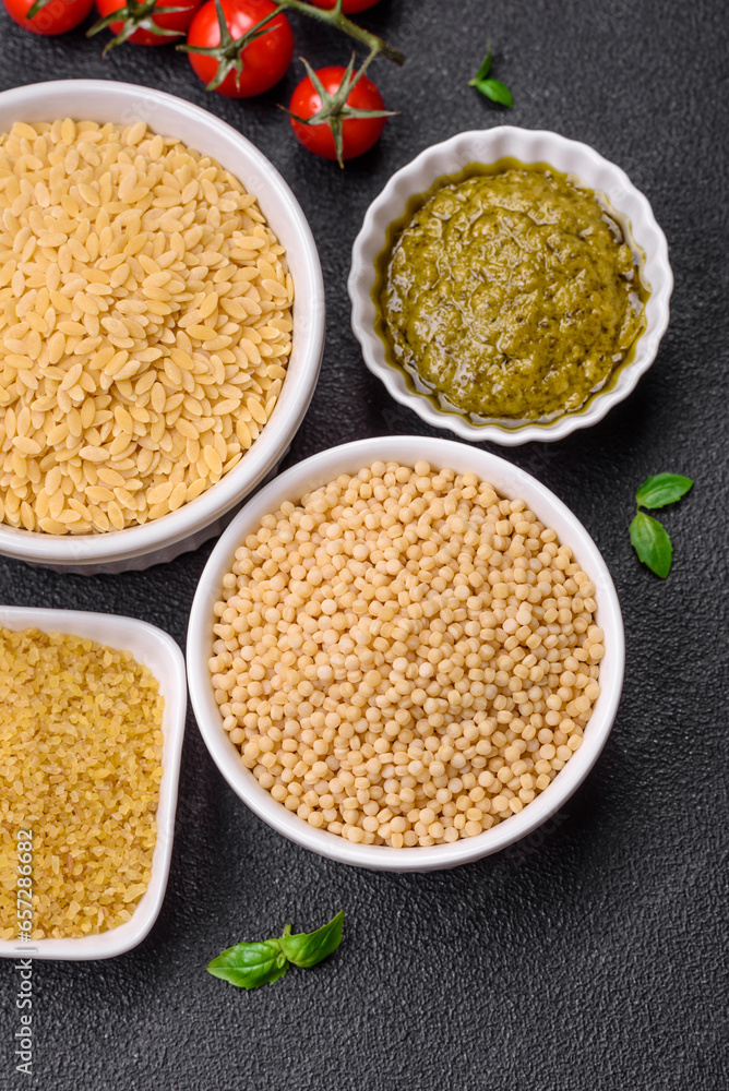 Raw whole grain orzo pasta as an ingredient for a delicious dish Raw whole grain orzo pasta as an ingredient for a delicious dish