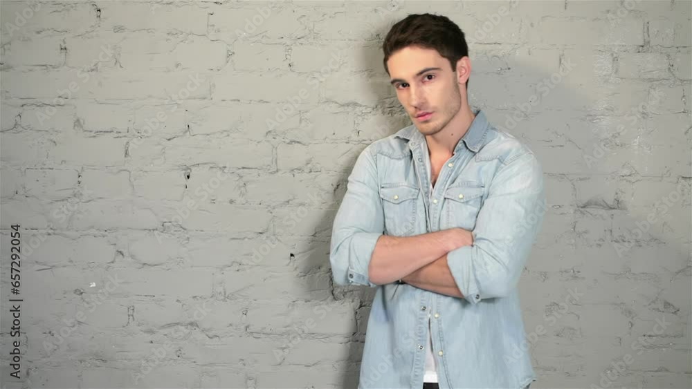 Male posing in a denim and a white T-shirt Male posing in a denim and a white T-shirt