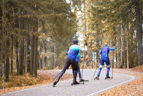 Man ride roller skis in the autumn Park. photo