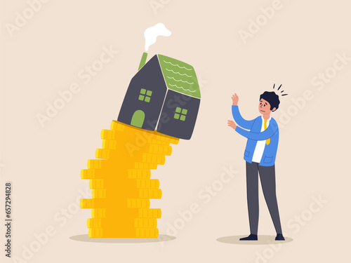Economic recession concept. Property and housing market collapse, real estate stock risk, businessman house owner or real estate agent help protect the house to fall off unstable stack of coins.