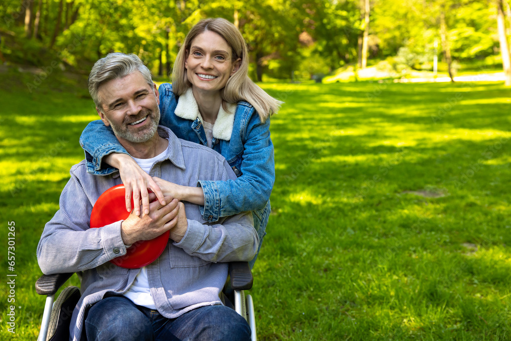 Cute couple hugging each other and looking happy in the park Cute couple hugging each other and looking happy in the park