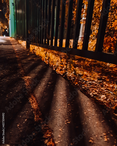 light from a lantern through the fence