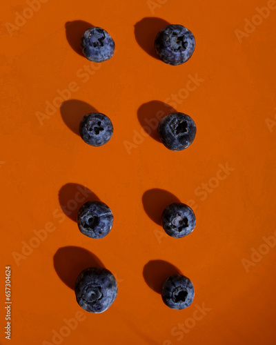 blueberries on an orange plate