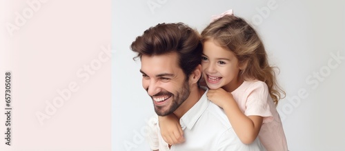 Woman with laptop being hugged by man and child with smiles With copyspace for text