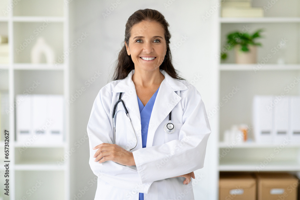 Portrait of friendly smiling middle aged woman doctor Portrait of friendly smiling middle aged woman doctor