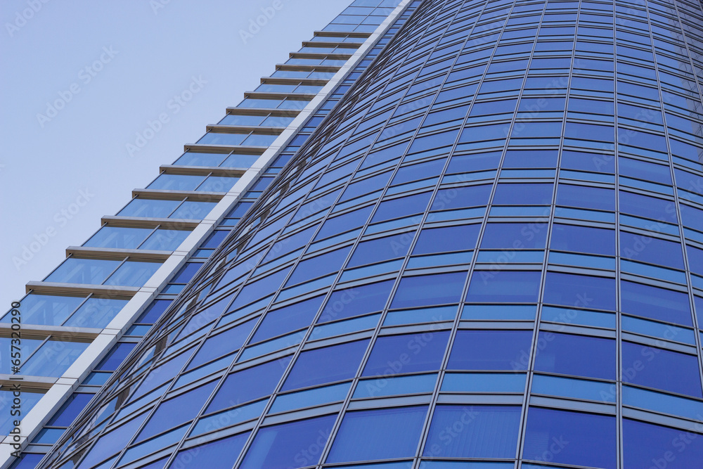 modern glass office building in the city with blue sky modern glass office building in the city with blue sky