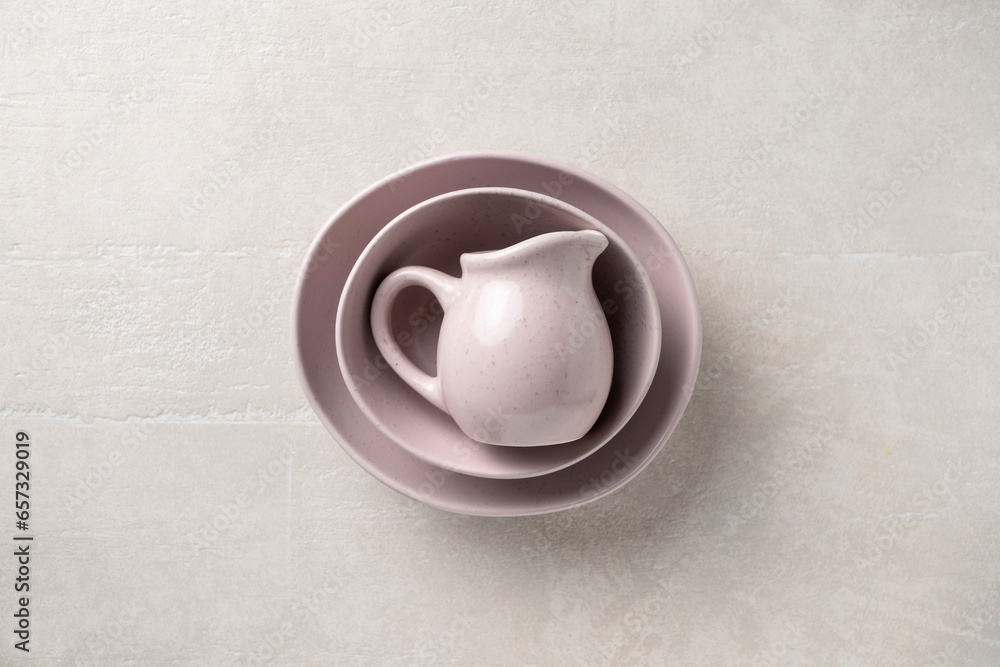Pottery on a concrete light background, top view, homeware Pottery on a concrete light background, top view, homeware
