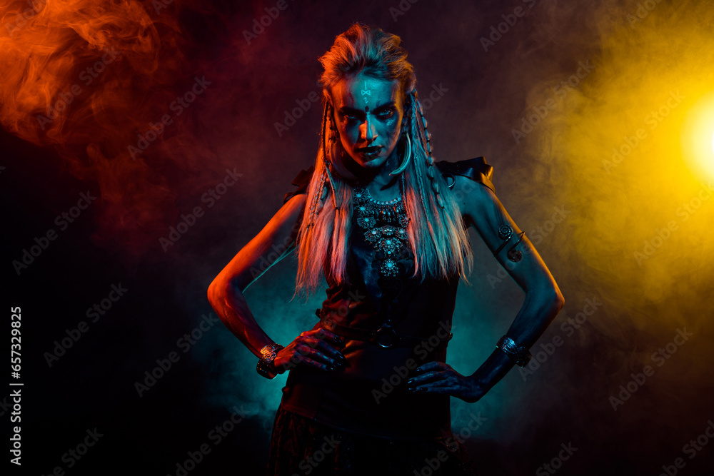Photo of attractive cool mystic woman wear gothic valkyrie costume ritual isolated orange fog color background
