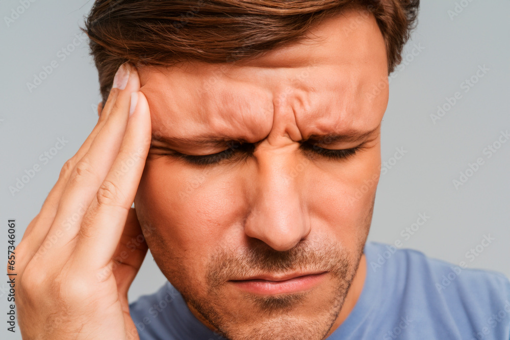 Portrait of a blond white man with a severe headache Portrait of a blond white man with a severe headache