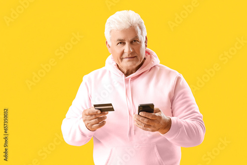 Senior man with credit card...