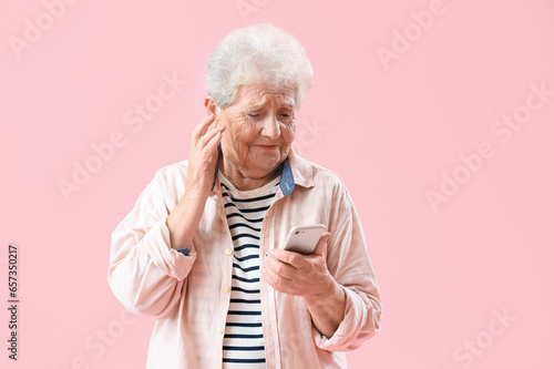 Senior woman using mobile p...