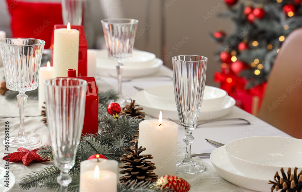 Festive table setting with Christmas decor at home Festive table setting with Christmas decor at home