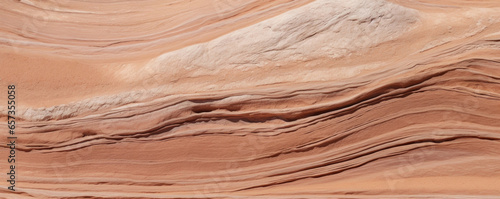 Texture of sandstone with chaotic ripple patterns, resembling the unpredictable movements of windblown sand. The stone appears to be in a constant state of flux, changing with the slightest