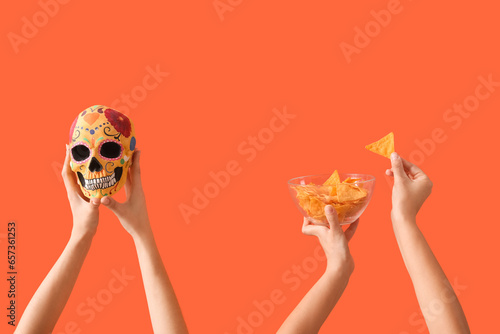 Female hands holding nachos...