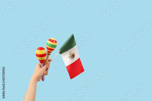 Female hand holding maracas...
