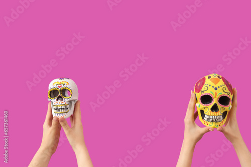 Female hands holding painte...