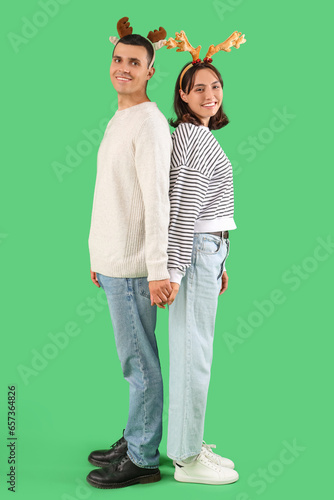 Happy young couple wearing ...