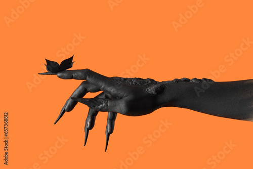 Black painted hand with lon...