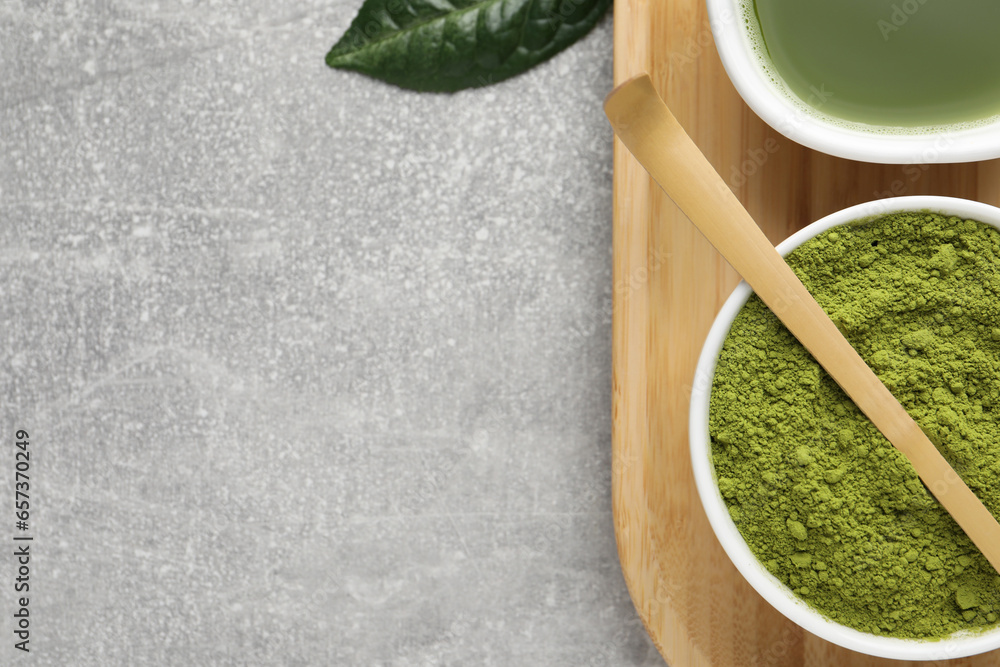 Green matcha powder, bamboo scoop and fresh beverage on light grey table, flat lay. Space for text Green matcha powder, bamboo scoop and fresh beverage on light grey table, flat lay. Space for text