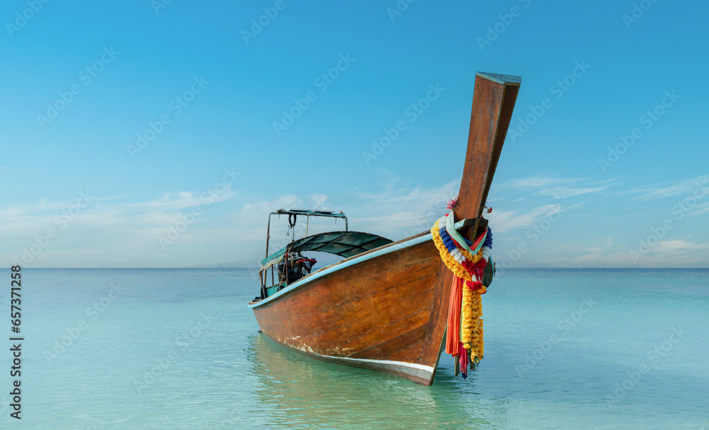 Thai traditional wooden longtail boat and beautiful sand Railay Beach in Krabi province, Thailand. Thai traditional wooden longtail boat and beautiful sand Railay Beach in Krabi province, Thailand.